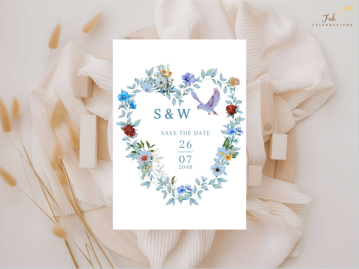 Romantic Save the Date template featuring a blue floral heart wreath, graceful dove motif and elegant typography for beautifully coordinated wedding stationery.
