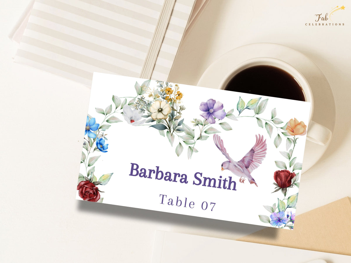 Elegant floral name card featuring watercolor-inspired garden flowers, delicate greenery and a graceful dove framing the guest name Barbara Smith with reception table number 07.