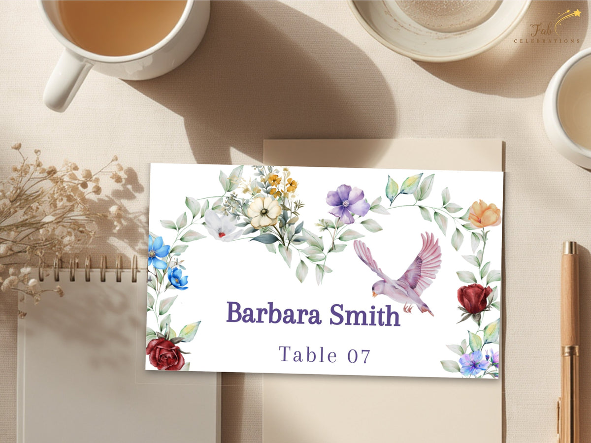 Boho Watercolor Wedding Card floral place card featuring watercolor-inspired multicolored blossoms, soft greenery and a graceful dove around the guest name Barbara Smith and table number 07.