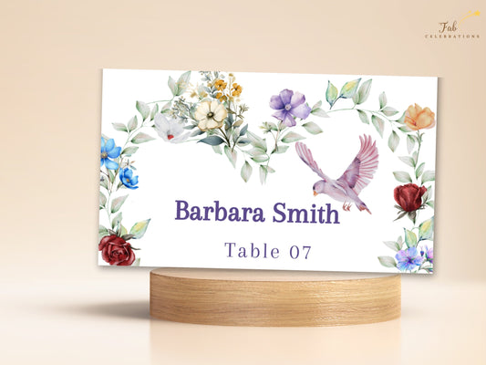 Boho Watercolor Wedding Card place card featuring watercolor-inspired colorful flowers, soft leafy greenery and a graceful dove framing the guest name Barbara Smith and table number 07.