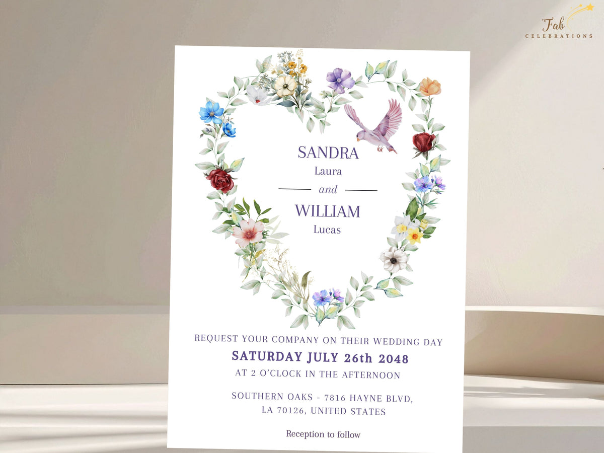 Dove Wedding Invitations card featuring a watercolor-inspired floral heart of colorful blossoms and soft greenery, a graceful flying dove and elegant purple wedding typography.
