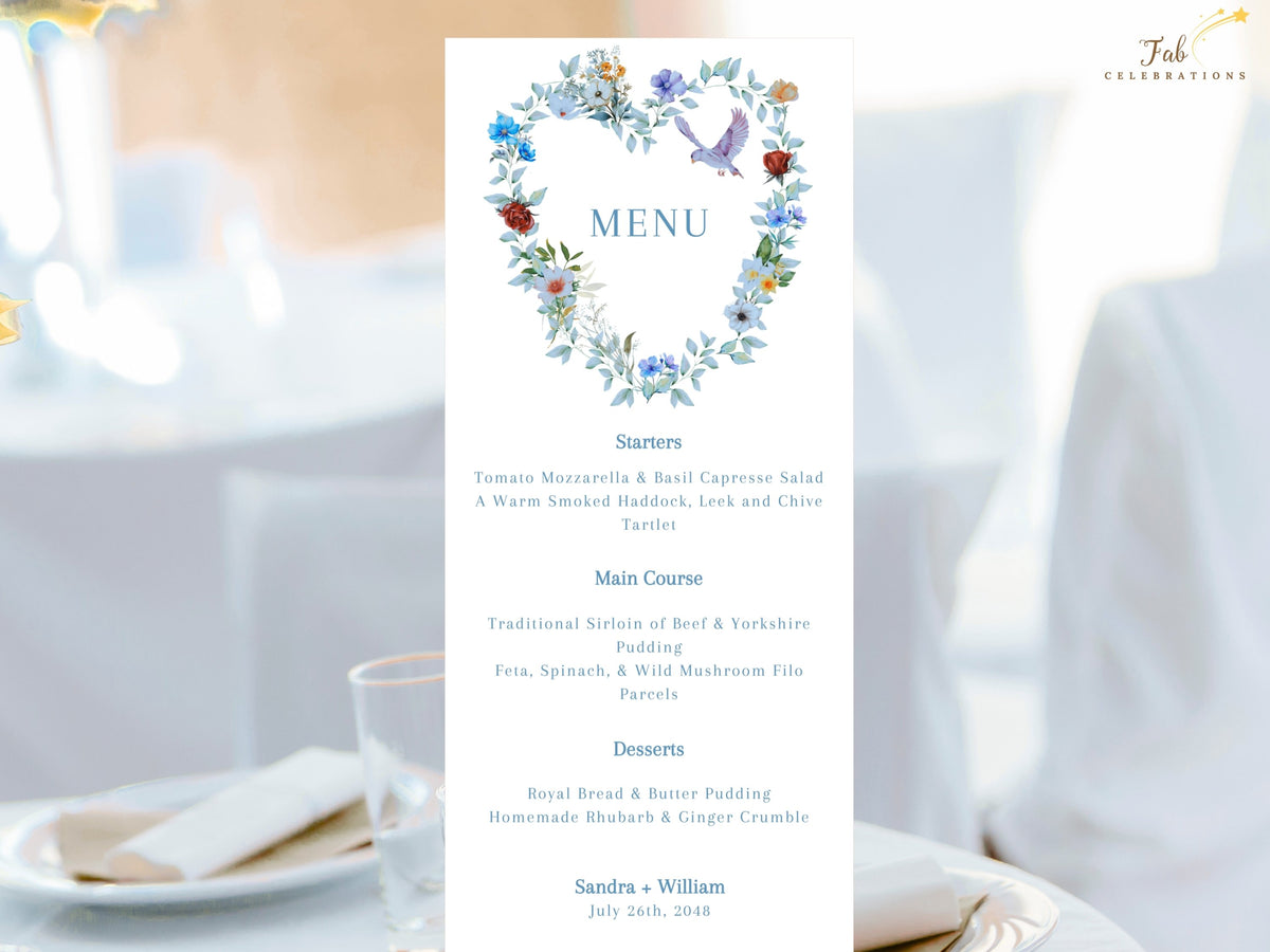 Wedding menu card featuring a watercolor-inspired floral heart wreath with dusty blue flowers and a dove above an elegant multi-course menu layout for coordinated reception table stationery.