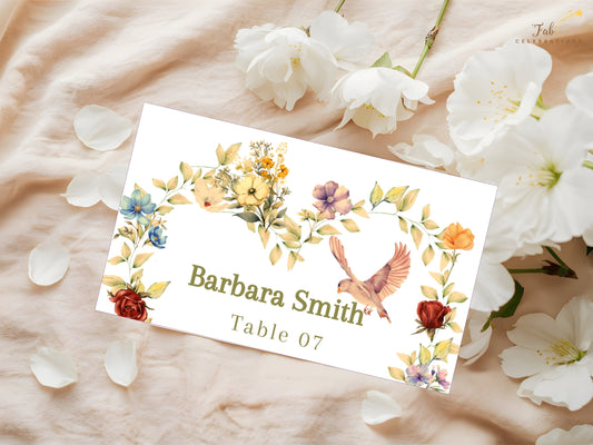 Romantic Wedding Name Card featuring a watercolor-inspired half floral heart wreath, graceful dove illustration, soft beige background and editable Canva design for elegant wedding place settings.