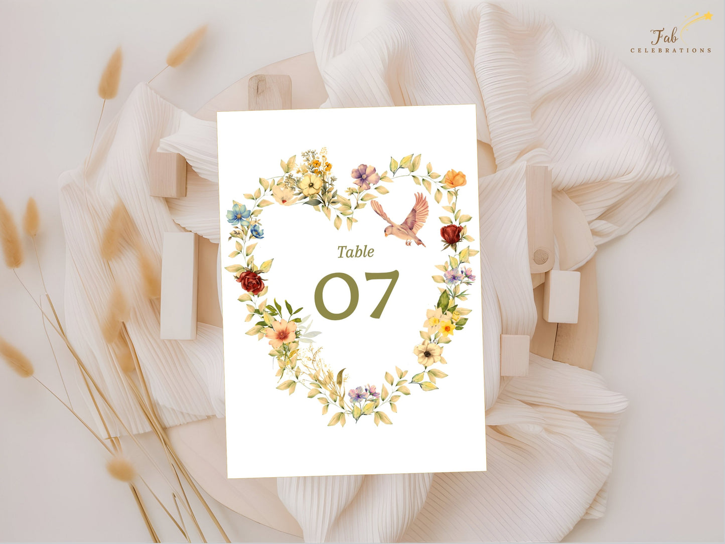 Floral heart table number decorated with peach apricot flowers, purple blue blossoms, graceful dove illustration and watercolor-inspired botanical artwork for elegant wedding tables.