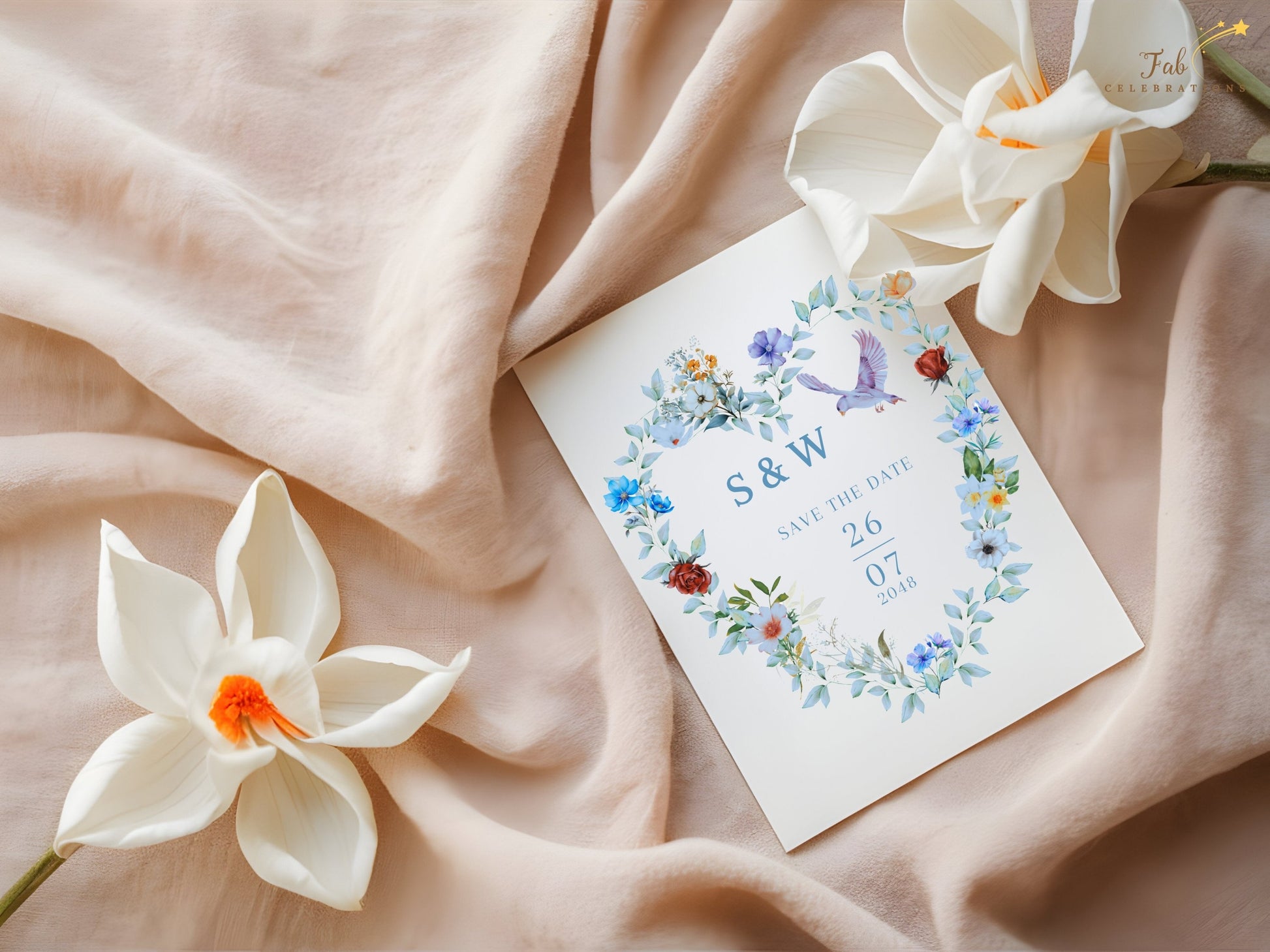 Watercolor-inspired wedding announcement card featuring blue and green botanical details, a delicate floral heart and symbolic dove artwork for romantic celebrations.