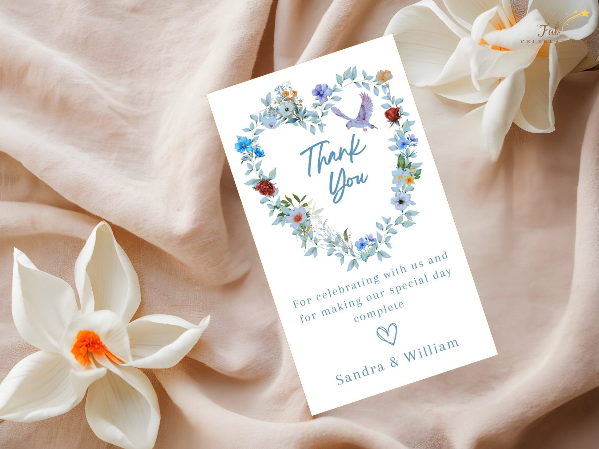 Romantic wedding thank you card featuring a blue floral heart wreath, graceful dove motif and elegant typography for beautifully coordinated wedding stationery.