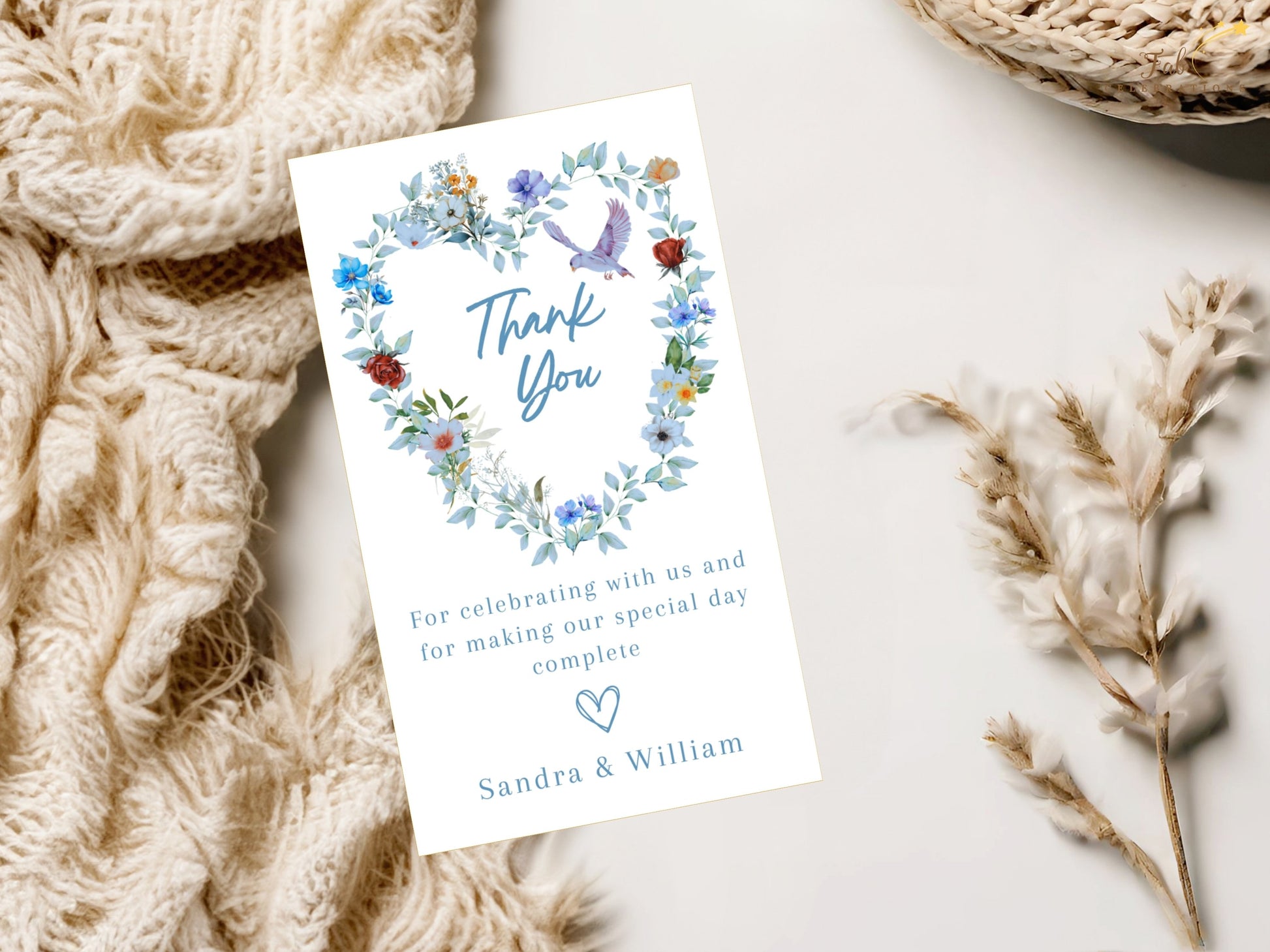 Watercolor-inspired thank you card featuring blue floral details, a symbolic dove and romantic artwork that complements a coordinated wedding stationery suite.