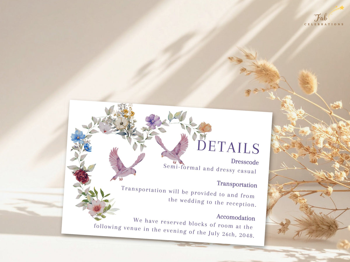 Ivory wedding information insert with watercolor-inspired botanical heart, pink doves and purple Details lettering, designed for dress code, transportation and accommodation notes.