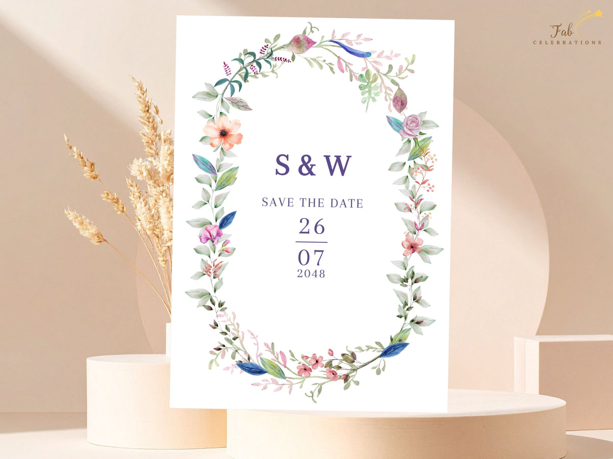 Editable floral wedding announcement card featuring a watercolor-inspired botanical wreath with personalized initials, save the date wording, and customizable date information.