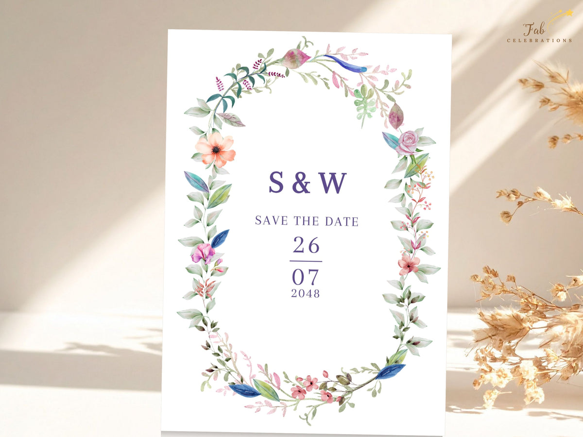 Elegant save the date announcement featuring a watercolor-inspired floral wreath surrounding customizable initials, refined wedding wording, and a personalized celebration date.