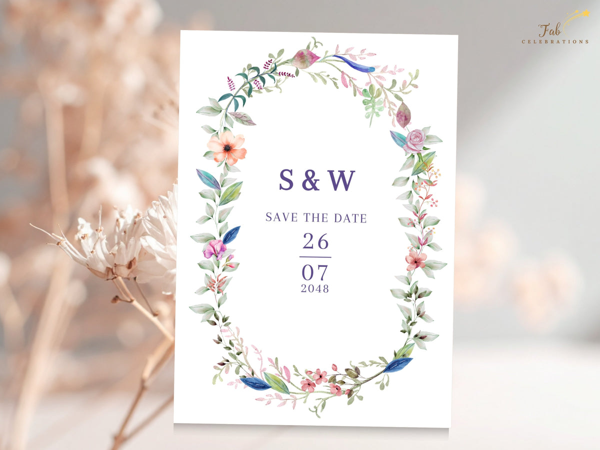 Wedding save the date card featuring a colorful watercolor-inspired floral wreath framing elegant initials, announcement wording, and a personalized celebration date.