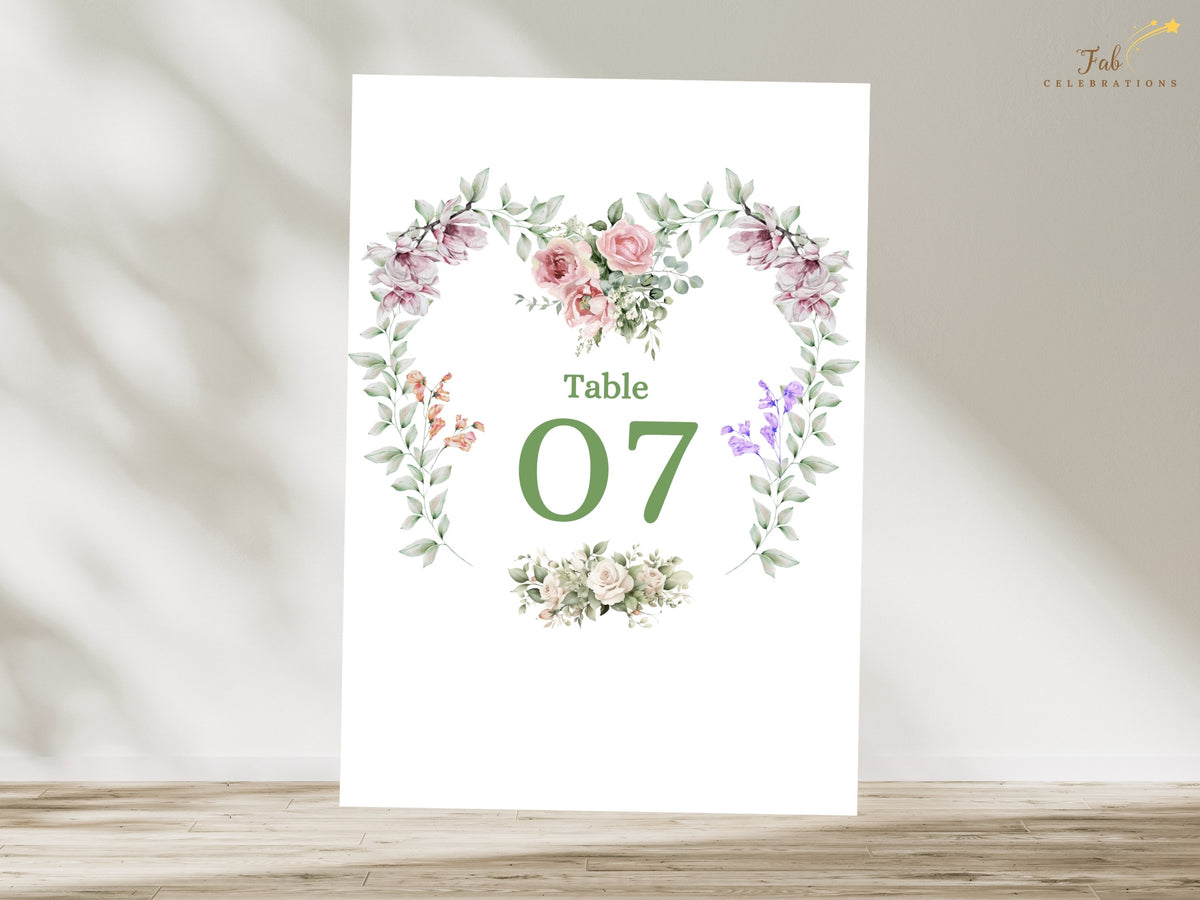 Editable Canva table number card featuring Table 07 inside a watercolor-inspired floral heart design with pink roses, purple flowers and coordinated soft green botanical accents.