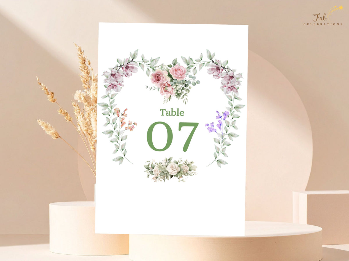Floral Wedding Template table number featuring Table 07 within a watercolor-inspired heart wreath of pink roses, purple blossoms and greenery for coordinated reception stationery.