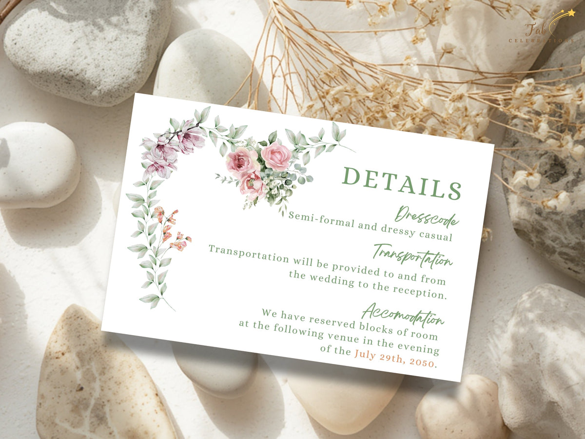 Botanical wedding details card featuring travel, transportation and accommodation information alongside watercolor-inspired pink flowers, purple blossoms and delicate leafy accents.