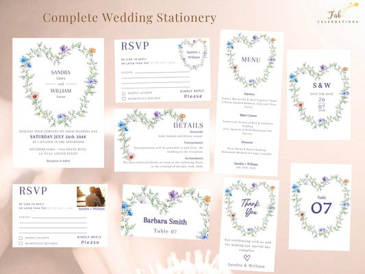 Heart Shaped Wedding Invitation Set featuring the complete collection of eleven coordinated Canva templates with a watercolor-inspired heart wreath of airy green foliage and delicate blue, purple, white and peach flowers.