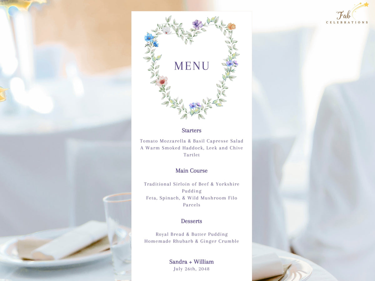 Wedding menu card featuring a watercolor-inspired floral heart wreath above the dinner courses, with airy green foliage, soft blue, purple, white and peach flowers and elegant purple typography.