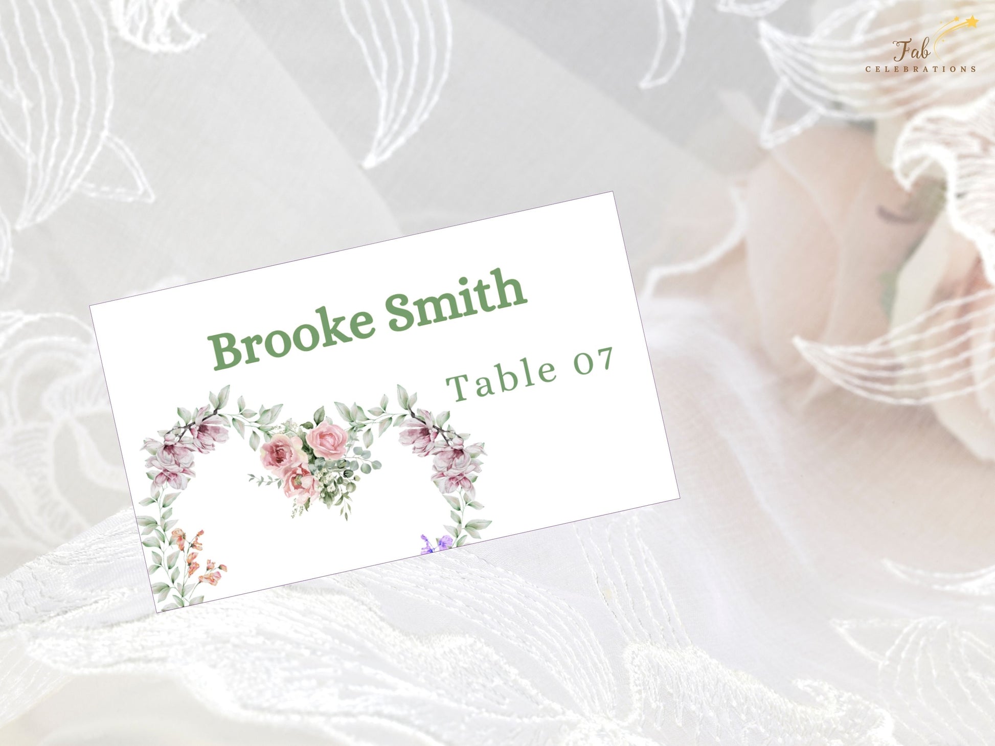 Ivory wedding invitations place card flatlay display featuring watercolor floral artwork and French-inspired typography for boho chic wedding stationery.
