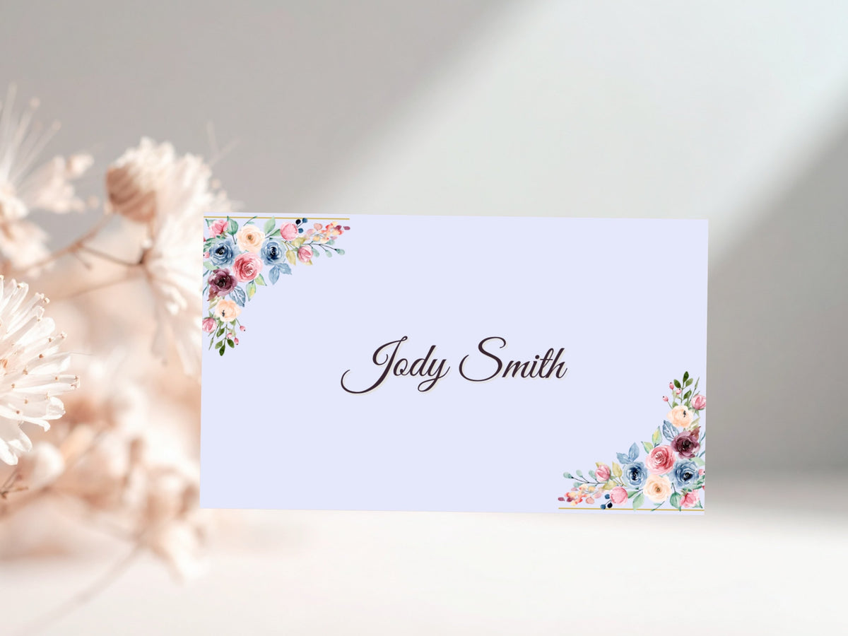 Mother’s Day place card featuring colorful watercolor-inspired floral details, delicate green foliage and elegant gold accents for a coordinated celebration table.
