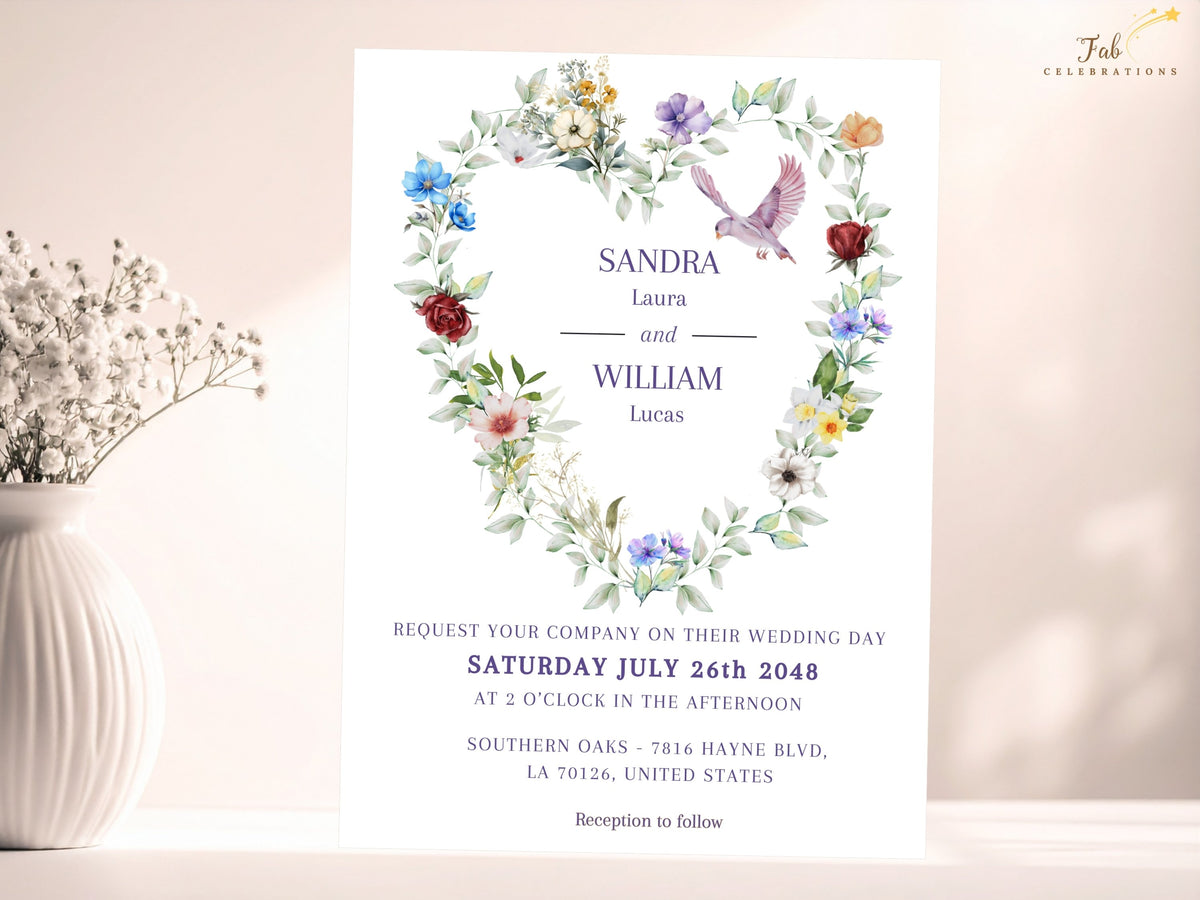 Wedding invitation front featuring a delicate watercolor-inspired floral heart, colorful garden blossoms, soft leafy greenery and a graceful dove framing elegant names and wedding information.