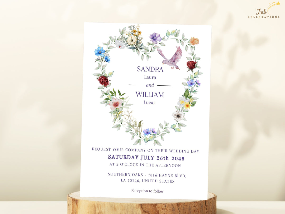 Wedding invitation front featuring a romantic watercolor-inspired heart of multicolored flowers and soft greenery with a flying dove, elegant names, wedding date and ceremony information.