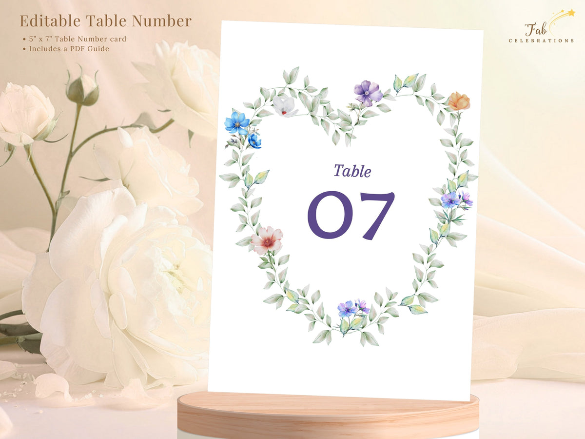 Pastel Garden Table Number shown with text highlighting the editable Canva table card, featuring a watercolor-inspired floral wreath, soft pastel flowers and a large elegant purple table number.