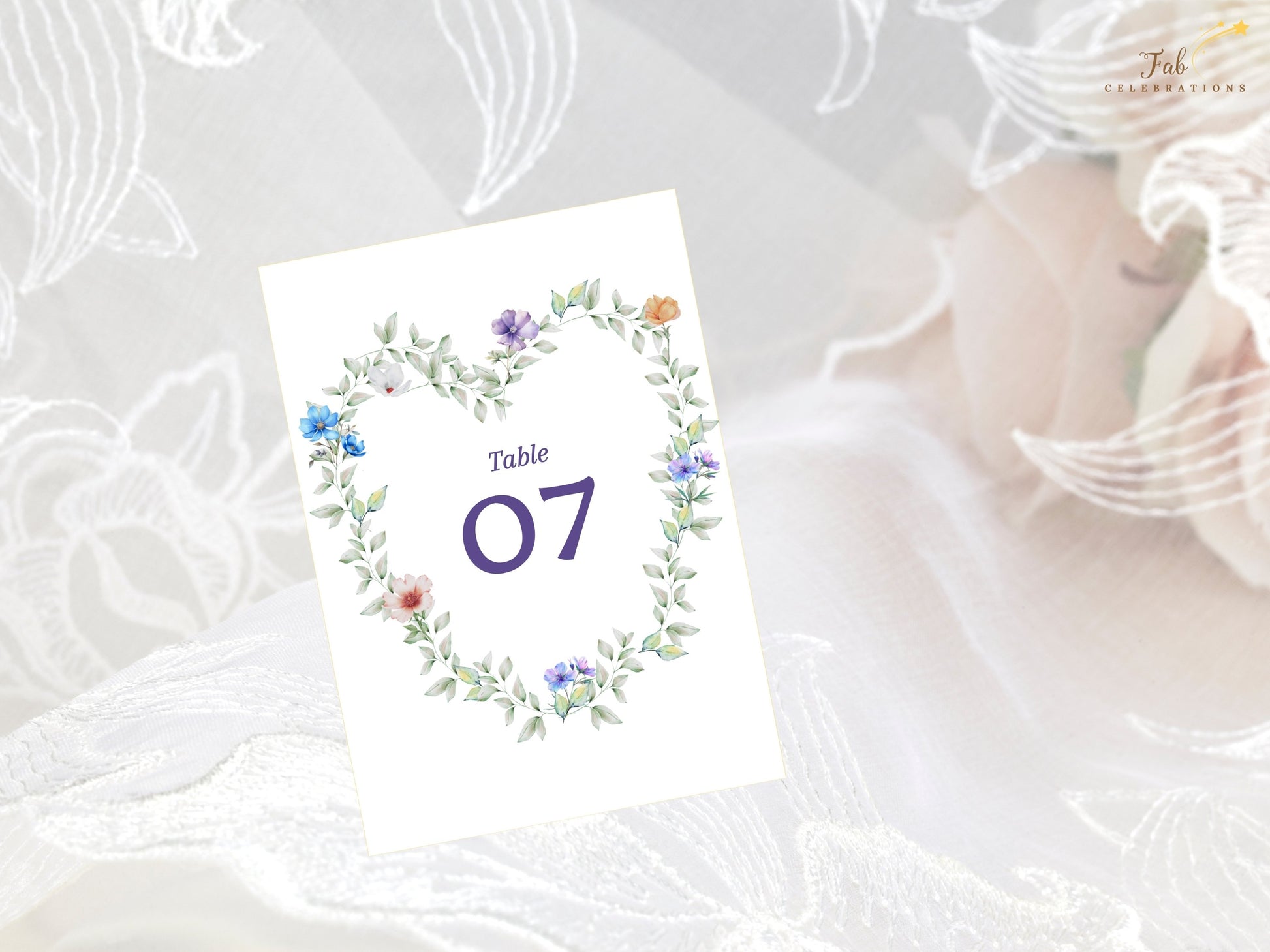 Pastel Garden Table Number editable Canva template featuring a romantic heart-shaped floral wreath with pastel flowers and greenery for elegant wedding receptions.