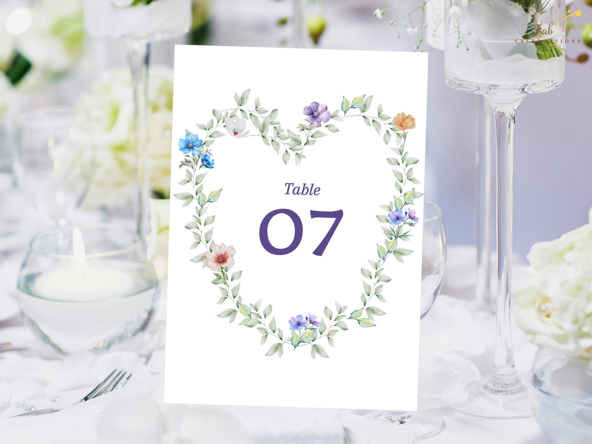 Pastel Garden Table Number editable Canva template featuring a heart-shaped watercolor-inspired floral wreath, designed to elegantly display reception table numbers while coordinating with your wedding stationery.