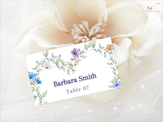 Pastel Wedding Name Card editable Canva template featuring a romantic heart-shaped floral wreath with pastel flowers and greenery for elegant wedding seating.
