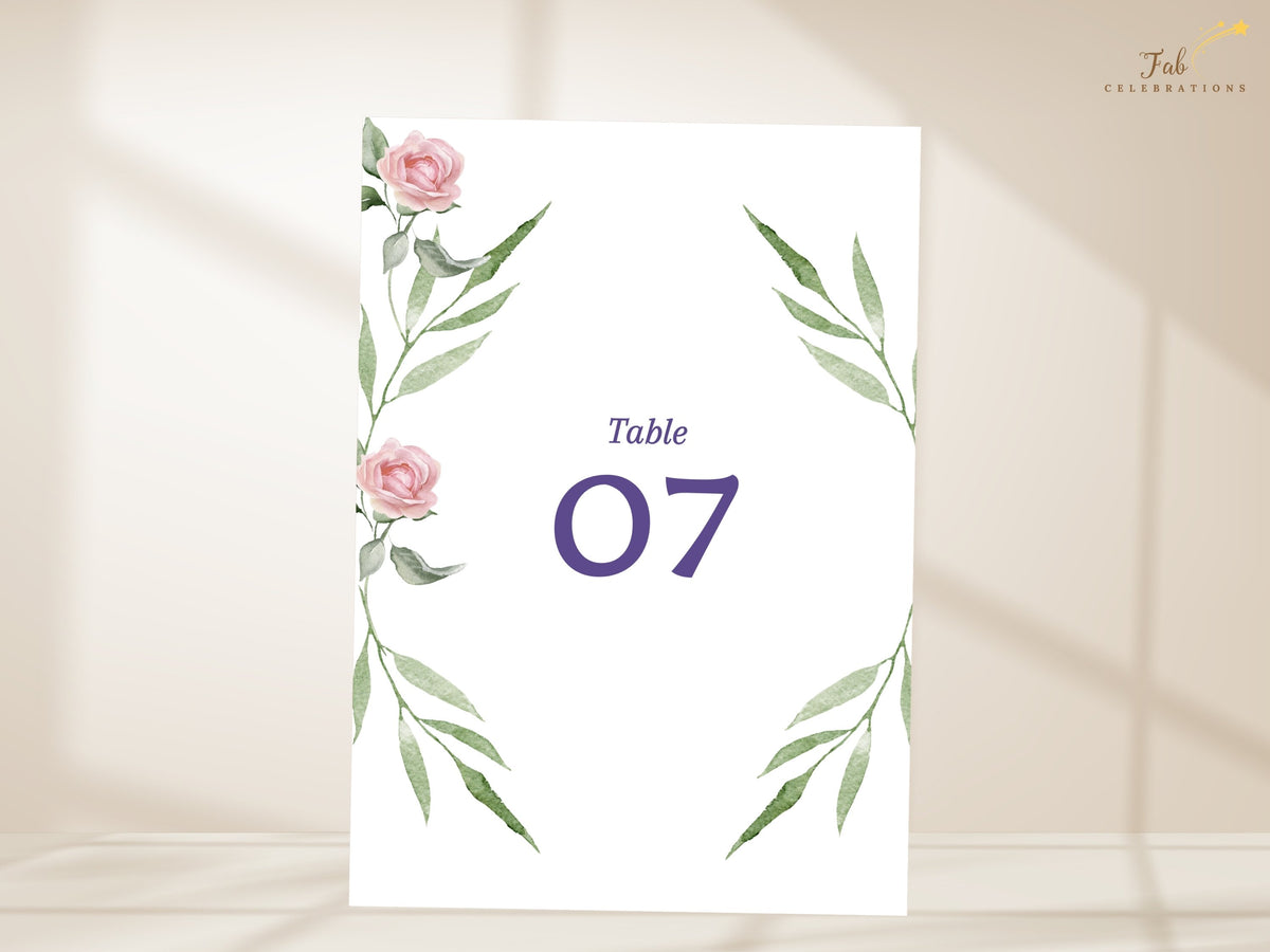 Elegant table number display featuring watercolor-inspired blush pink roses and airy green foliage, with a clear purple number designed to coordinate with romantic wedding reception stationery.