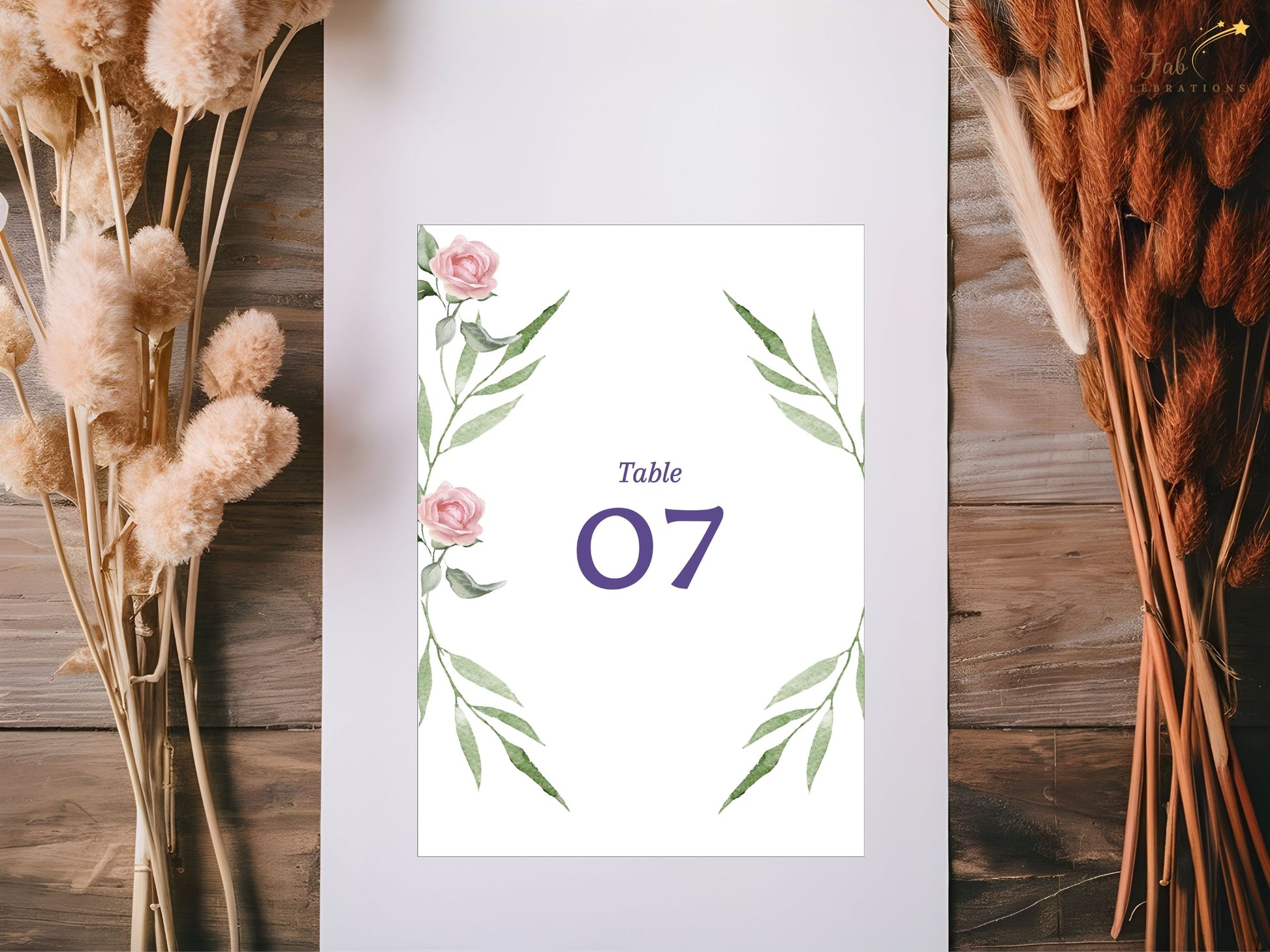 Editable pink rose table number card with watercolor greenery — Canva template for rustic chic, boho, and garden weddings seeking coordinated reception decor.