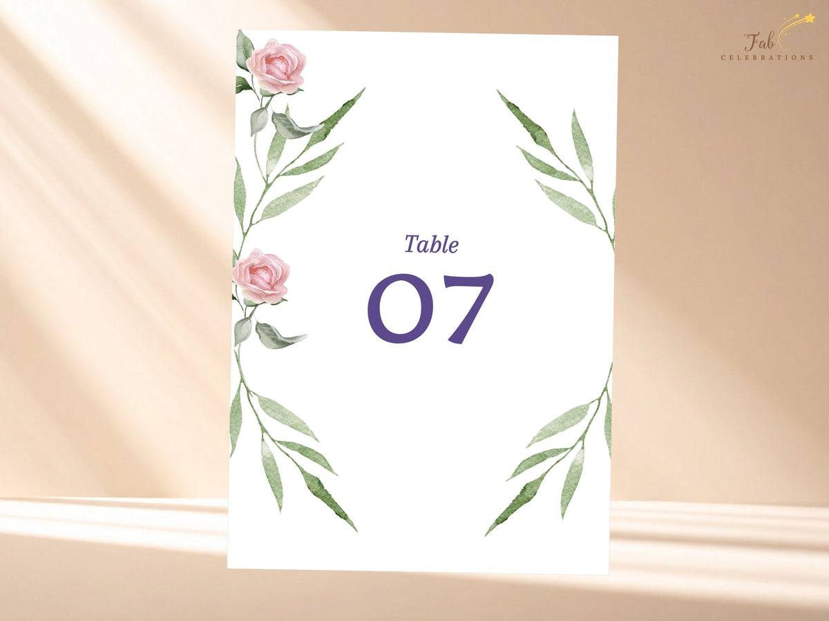Romantic wedding table number card featuring watercolor-inspired blush roses and flowing green leaves around a bold purple number for an elegant coordinated reception table display.