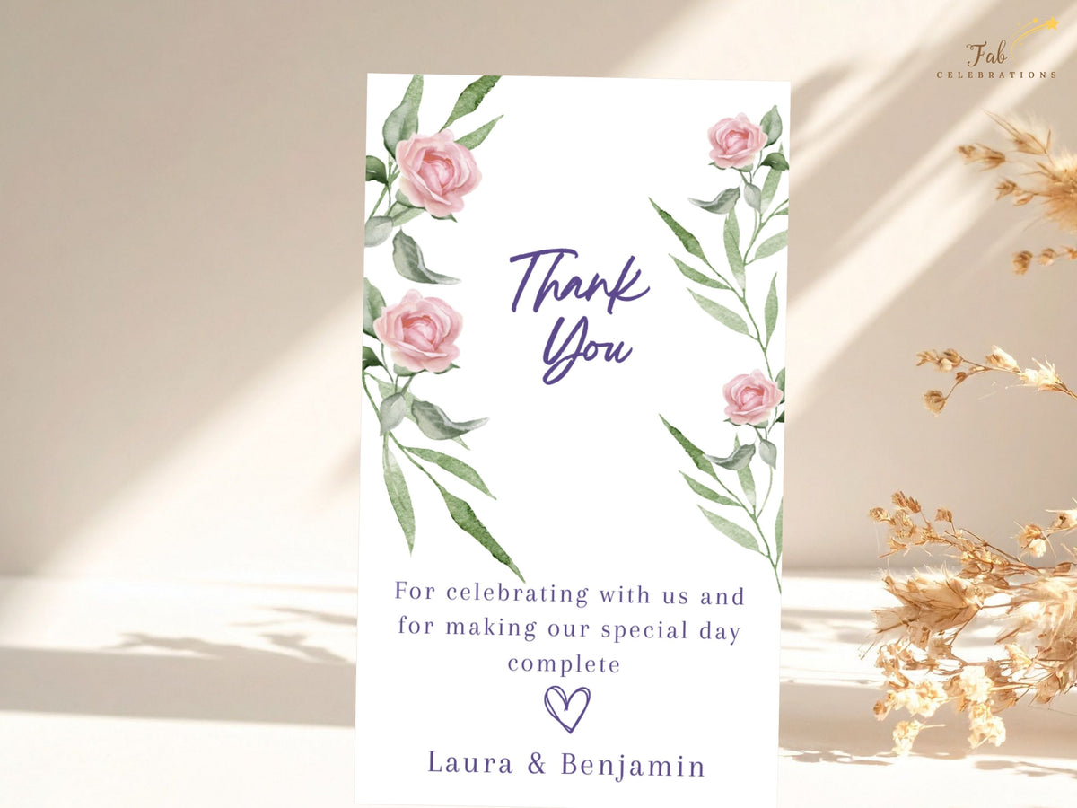 Elegant wedding gratitude card featuring watercolor-inspired pink roses and slender green foliage, with purple Thank You script, a heartfelt message and the couple's names in a balanced layout.