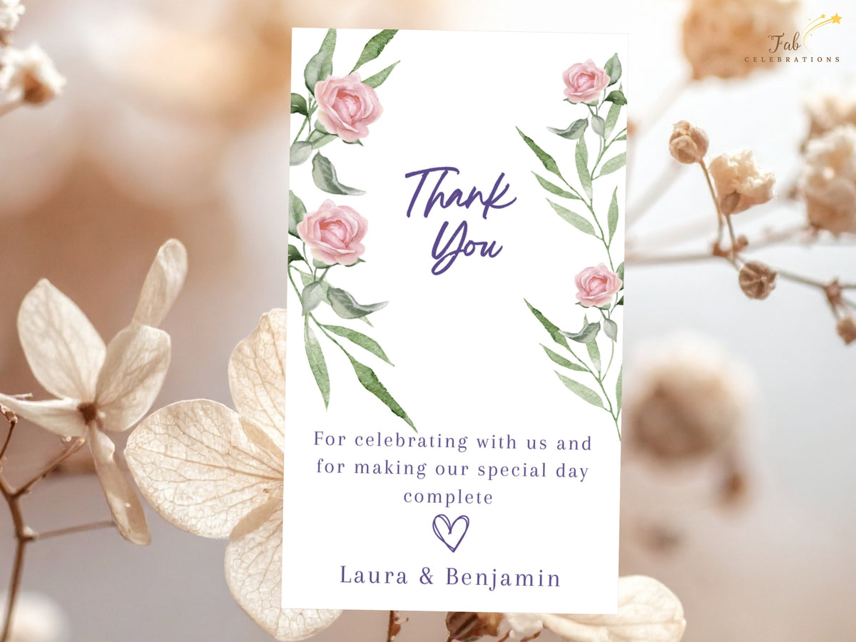 Romantic gratitude note featuring watercolor-inspired blush pink roses and delicate green foliage, with elegant Thank You lettering, a warm wedding message and the couple's names.