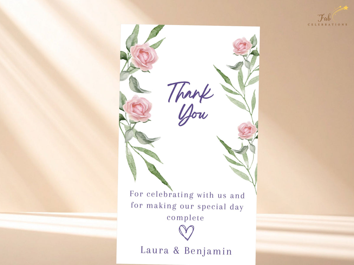 Romantic wedding thank you card featuring watercolor-inspired blush roses and graceful green foliage, with elegant purple lettering and a warm message of gratitude for wedding guests.