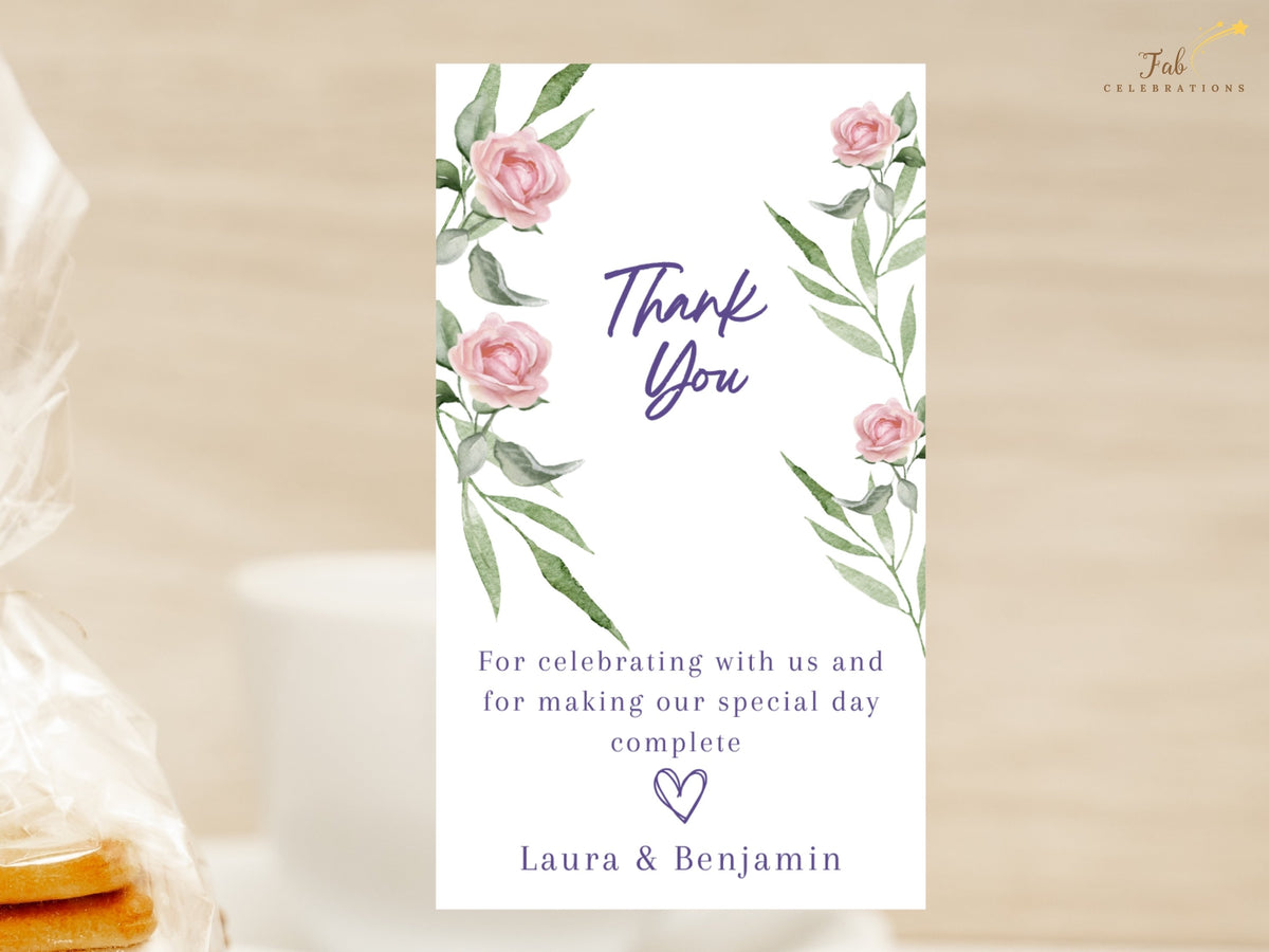 Wedding thank you note featuring watercolor-inspired pink roses and delicate botanical greenery, with elegant purple script, a heartfelt gratitude message and the couple's names.
