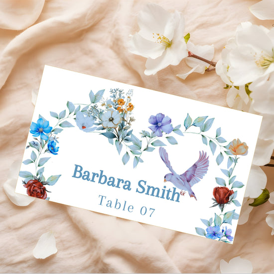 Video presentation of the Elegant Table Name Card featuring an editable Canva template with a watercolor-inspired floral border design, graceful dove motif, romantic botanical artwork and elegant wedding reception styling.