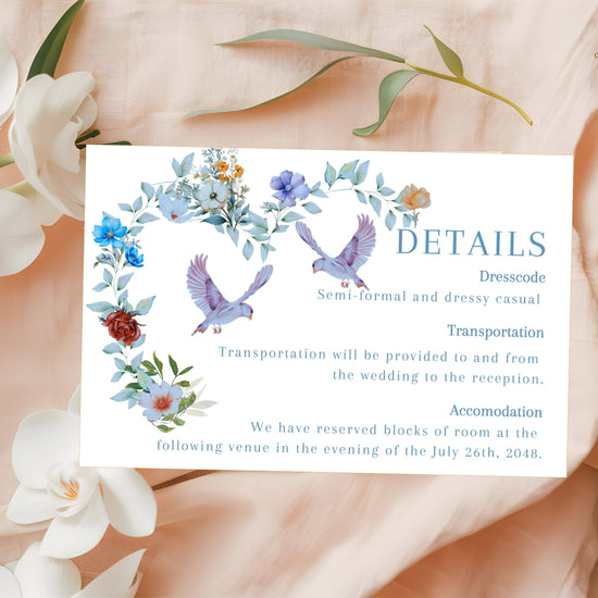 Video presentation of the Elegant Wedding Details Card featuring an editable Canva template with a watercolor-inspired blue floral heart design, two graceful doves, romantic botanical artwork and coordinated wedding stationery styling.