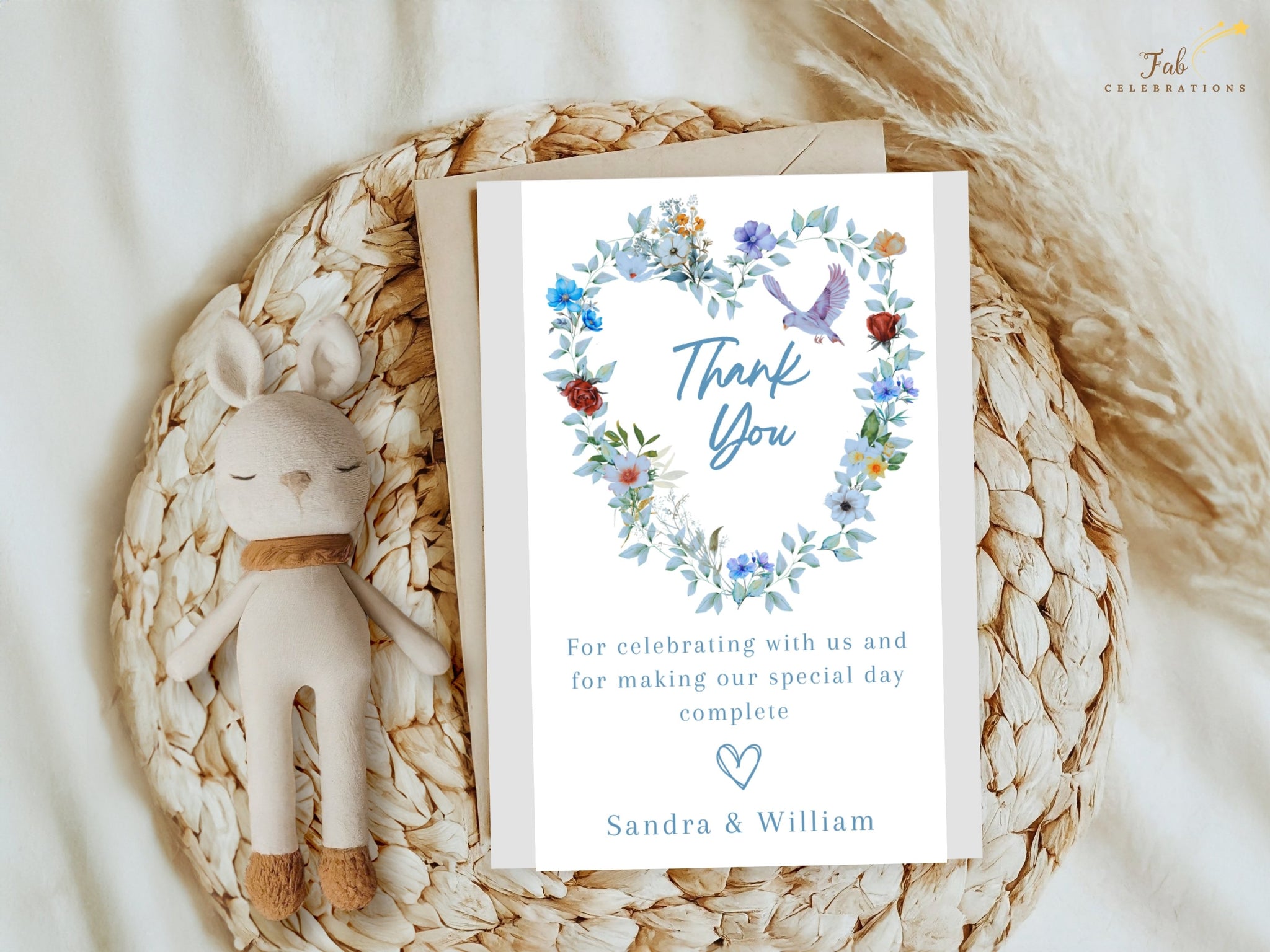 Video presentation of the Elegant Wedding Thank You Card featuring an editable Canva template with a watercolor-inspired blue floral heart wreath, graceful dove motif, romantic botanical artwork and elegant gratitude styling.