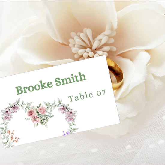 Tutorial showing how to edit ivory wedding invitations place card template in Canva, featuring watercolor floral heart design for rustic French countryside weddings.