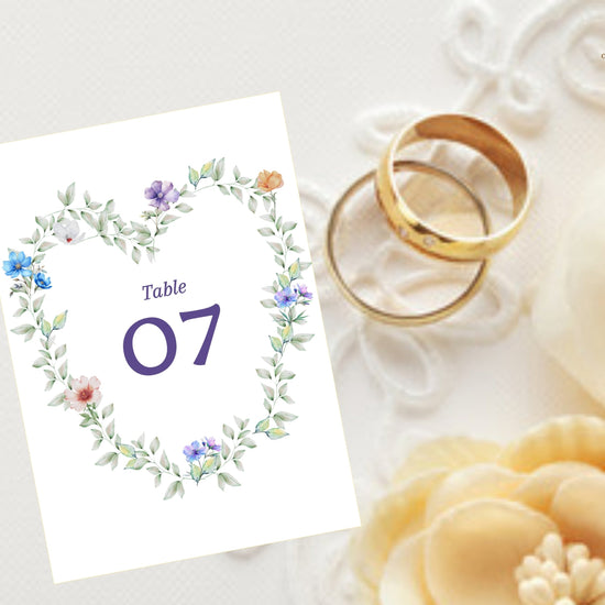 Pastel Garden Table Number editable Canva template featuring a watercolor-inspired floral heart wreath, romantic botanical details, elegant typography, and coordinated wedding reception stationery