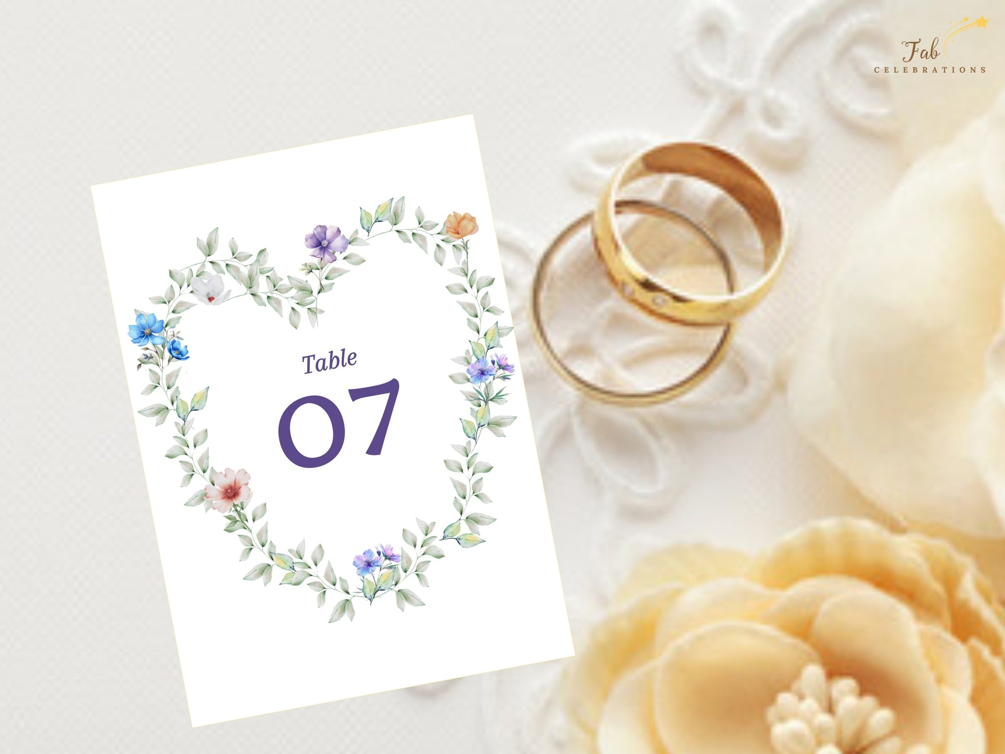 Pastel Garden Table Number editable Canva template featuring a watercolor-inspired floral heart wreath, romantic botanical details, elegant typography, and coordinated wedding reception stationery