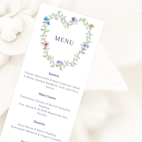 Pastel Wedding Menu Template editable Canva menu card featuring a watercolor-inspired floral heart wreath, romantic botanical details, elegant typography, and coordinated wedding reception stationery