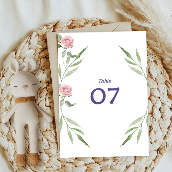 Pink rose wedding table number card with watercolor florals — editable Canva template to guide reception guests with timeless, romantic, and elegant charm.