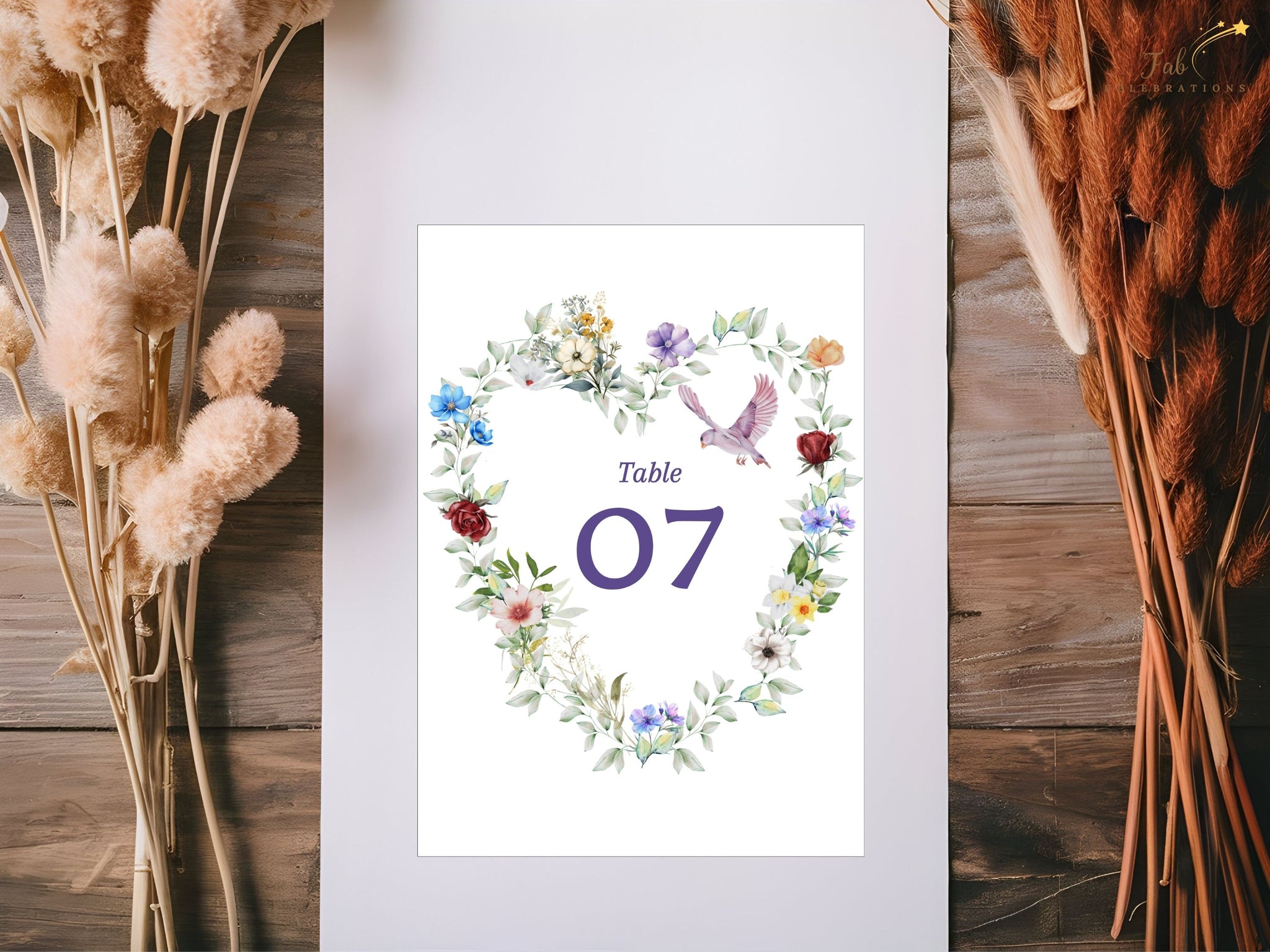 Canva tutorial showing editable wedding table number cards with floral heart design, graceful dove motif and delicate greenery for elegant French-inspired receptions.