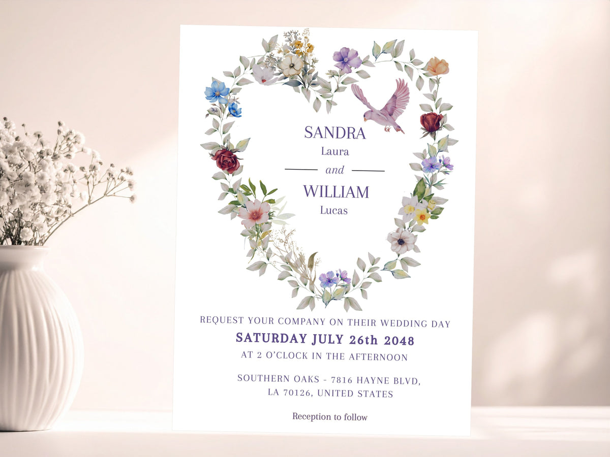 Classic purple floral wedding invitation front featuring a romantic floral heart, graceful dove and editable event lettering, designed to coordinate with the matching wedding stationery suite.