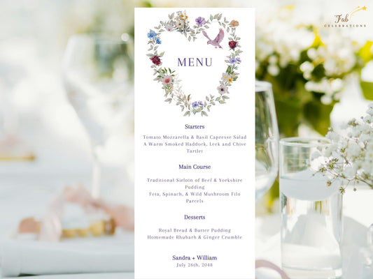 Purple Floral Wedding Menu Card featuring a watercolor-inspired heart wreath of violet, blush and blue flowers, delicate greenery and a pink dove above an elegant, editable reception menu.