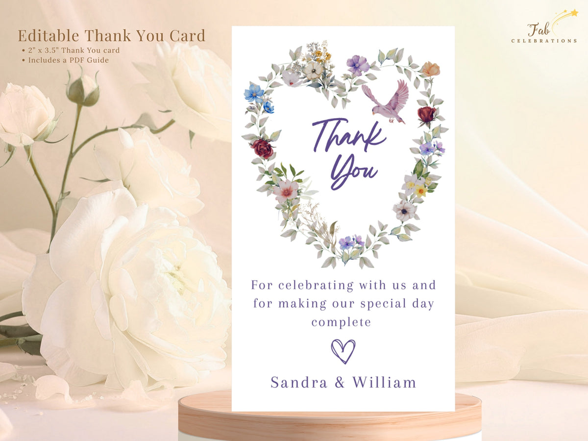 Purple Floral Wedding Thank You Card displaying editable gratitude wording beneath a watercolor-inspired heart of garden flowers, with a delicate pink dove and personalized couple names below.