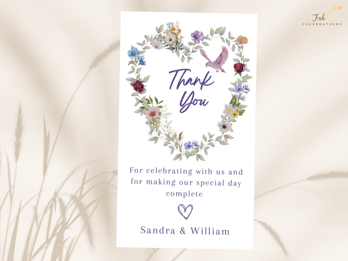Printable wedding gratitude stationery with watercolor-inspired floral heart artwork, a pink dove and graceful purple lettering, plus editable thank you wording and a couple signature below.