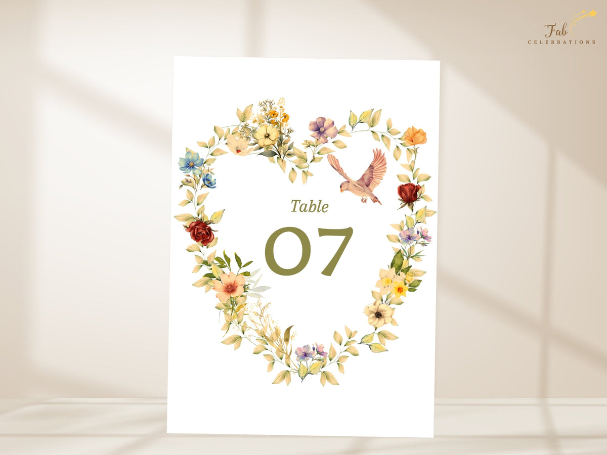 Romantic heart wreath wedding table number template featuring watercolor-inspired botanical florals, paired doves, sage leaves, and editable olive green numbering for a coordinated celebration.