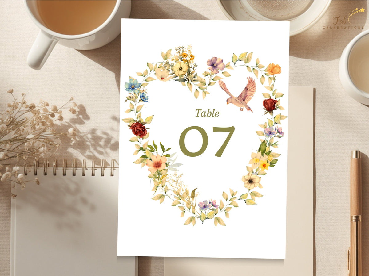 Romantic wedding table number card featuring an olive green 07 within a watercolor-inspired floral heart, with delicate doves, golden flowers, blush blooms, and airy botanical details.